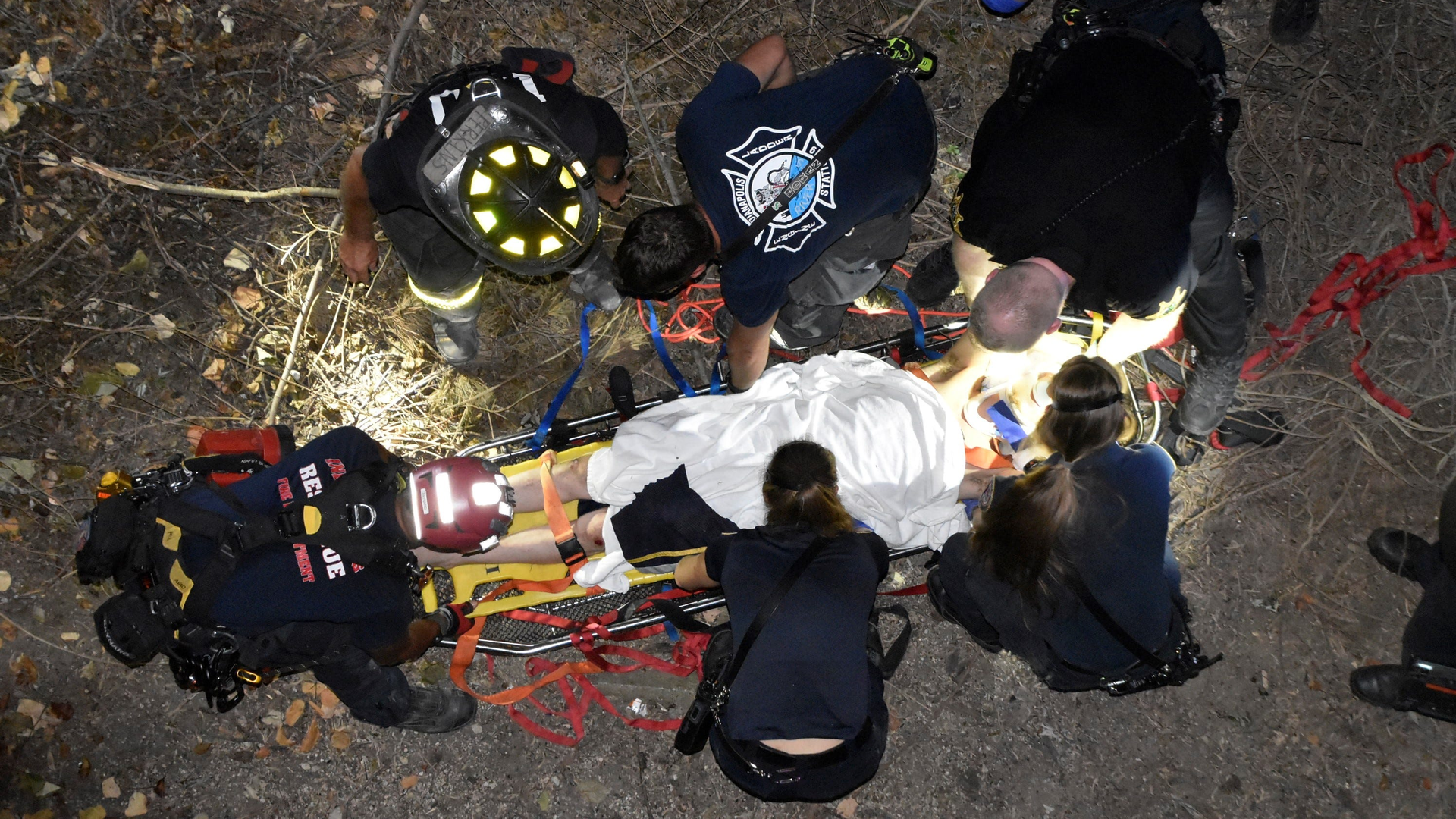 Indianapolis firefighters rescued a 36-year-old man who fell 35 feet from a wall that borders the Indianapolis Zoo early Wednesday.