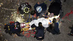 Indianapolis firefighters rescued a 36-year-old man who fell 35 feet from a wall that borders the Indianapolis Zoo early Wednesday.