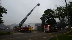 A Jackson, MI, firefighter suffered first- and second-degree burns on his upper arm during a large commercial blaze Wednesday.
