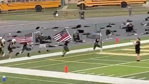 Two Little Miami, OH, High School football players were suspended from the team after carrying 'thin red line' and 'thin blue line' flags onto the field before a game Friday.