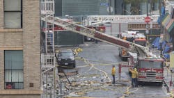Members of the Los Angeles Fire Department investigate the scene of a fiery explosion on in the city&apos;s Toy District that severely burned 11 firefighters and damaged buildings and fire equipment, authorities said.
