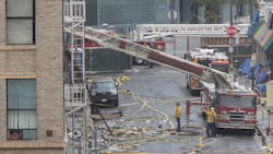 Members of the Los Angeles Fire Department investigate the scene of a fiery explosion on in the city's Toy District that severely burned 11 firefighters and damaged buildings and fire equipment, authorities said. Members of the Los Angeles Fire Department investigate the scene of a fiery explosion on in the city's Toy District that severely burned 11 firefighters and damaged buildings and fire equipment, authorities said.