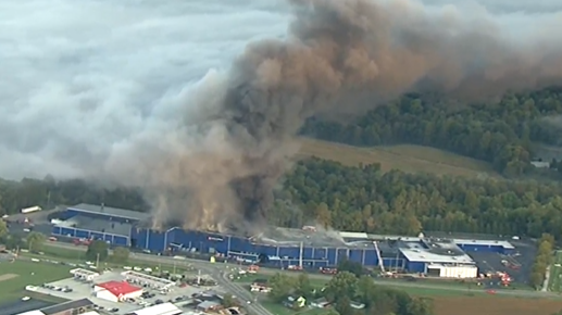 Firefighters from around a dozen departments battled a massive blaze at a manufacturing plant in Malvern, OH, on Tuesday.