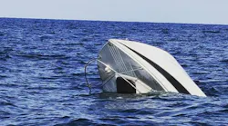 Muskegon, MI, and North Shore firefighters rescued two people who were clinging to the railing as their 20-foot boat sank into Lake Michigan on Monday.