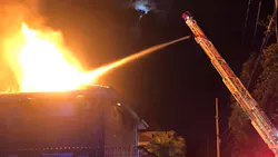 New Orleans firefighters battled a three-alarm blaze that broke out in a two-story apartment complex in the city's Garden District late Monday.
