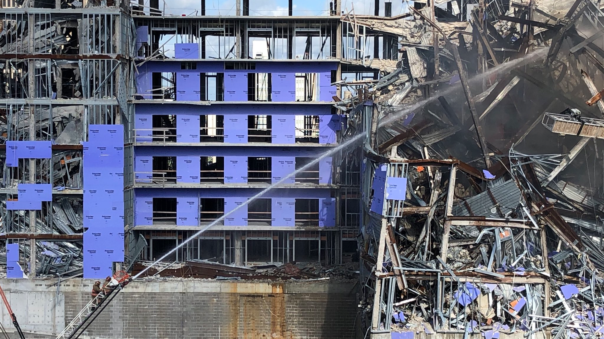 New Orleans crews battled a one-alarm fire that broke out Monday at the site of the collapsed Hard Rock Hotel.