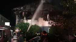 FDNY firefighters put out a house fire in New Springville on Staten Island, NY, one of the three residential blazes crews faced in a five-hour span late Monday and early Tuesday that injured nine firefighters.