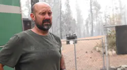 Robert Daniels, a hotshot crew firefighter, saved his Berry Creek, CA, home from the Bear Fire on Tuesday using buckets and bottles of water.
