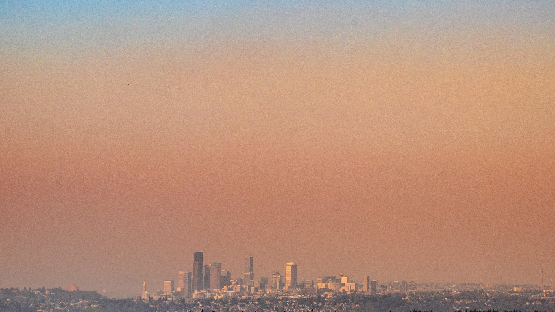 Smoke from central and eastern Washington wildfires blew into western Washington, worsening air quality across the Seattle area.