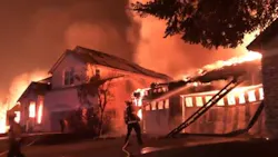 Firefighters battled the Shady Fire as its out-of-control flames engulf homes in Santa Rosa, CA, late Sunday and early Monday.