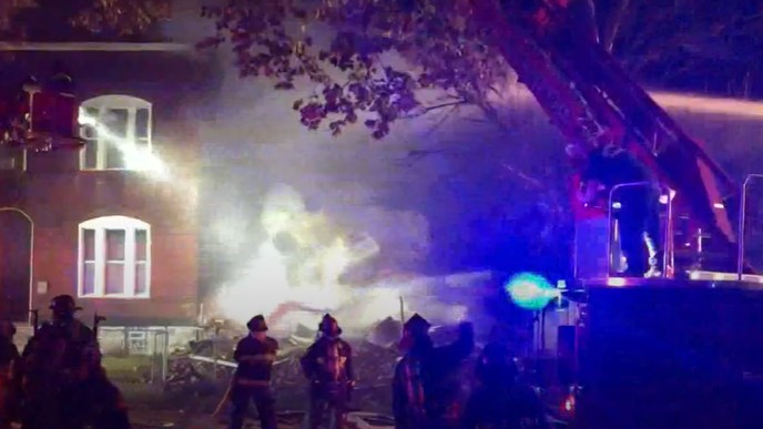 Sixty St. Louis firefighters battled a two-alarm blaze that erupted after a two-story house exploded late Tuesday.