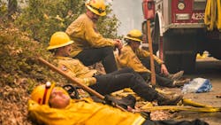 CAL FIRE firefighters (from left) Rob Spitzer, Max Kitty, Josiah Gist and Hunter Grossmann take a break during operations against the Creek Fire in Madera County, CA, on Sept. 8, 2020. CAL FIRE firefighters (from left) Rob Spitzer, Max Kitty, Josiah Gist and Hunter Grossmann take a break during operations against the Creek Fire in Madera County, CA, on Sept. 8, 2020.