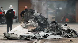 Los Angeles City firefighters extinguished the burning wreckage from a fatal plane crash just west of Van Nuys Airport on Friday.
