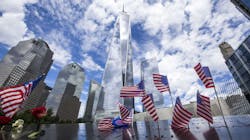 The Freedom Tower at One World Trade Center rises in the background of the 9/11 Memorial in lower Manhattan in New York City. The Freedom Tower at One World Trade Center rises in the background of the 9/11 Memorial in lower Manhattan in New York City.