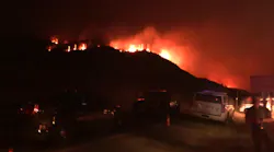 Three firefighters suffered minor injuries when they were caught in burnover conditions during the Bridger Foothills Fire near Bozeman, MT.
