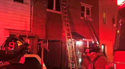 Jersey City, NJ, firefighters rescued a woman who was trapped on the top floor of a burning three-story residential building Tuesday.