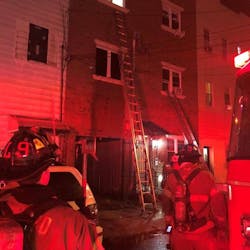 Jersey City, NJ, firefighters rescued a woman who was trapped on the top floor of a burning three-story residential building Tuesday. Jersey City, NJ, firefighters rescued a woman who was trapped on the top floor of a burning three-story residential building Tuesday.
