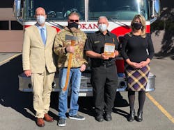 Pictured from left: Steve Danyluk, Boone Cutler, Spokane Fire Department Chief Brian Schaeffer, and Spokane Mayor Nadine Woodward. Pictured from left: Steve Danyluk, Boone Cutler, Spokane Fire Department Chief Brian Schaeffer, and Spokane Mayor Nadine Woodward.