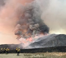 Firefighters watch as the El Dorado burns thousands of acres over the weekend.