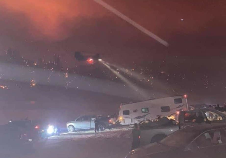 Helicopters from several agencies flew into the Mammoth Pool Reservoir to rescue campers as the fire quickly spread to their location.