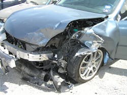 Figure 1. As you approach this sedan, you note an offset frontal crash and that the driver&rsquo;s door already is open. Start thinking about potential mechanism of injury possibilities for at least the driver prior to making patient contact.