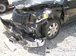 Figure 3. Approach to this crash-damaged two-door convertible shows the &ldquo;crumple zone&rdquo; at the front of the vehicle.