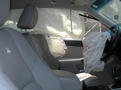 Perspective from the passenger’s side of the sedan shows the three deployed airbags, the blood splatters and the lack of passenger-side airbag deployment. Perspective from the passenger’s side of the sedan shows the three deployed airbags, the blood splatters and the lack of passenger-side airbag deployment.