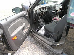 The driver’s door of the convertible is open partially, the steering column with a deployed airbag is on the floorboard, and the instrument panel, A-pillar, floorboard and rocker appear undamaged. Also, there are no seat airbag IDs on the driver’s seat, so you anticipate that this vehicle has no side-impact seat airbags. All of these are good size-up assessment points to note. The driver’s door of the convertible is open partially, the steering column with a deployed airbag is on the floorboard, and the instrument panel, A-pillar, floorboard and rocker appear undamaged. Also, there are no seat airbag IDs on the driver’s seat, so you anticipate that this vehicle has no side-impact seat airbags. All of these are good size-up assessment points to note.