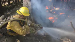 A U.S. Forest Service engine crewmember sprays down flames on the northwest flank of the August Complex, above Ruth Valley, CA, on Sept. 22.