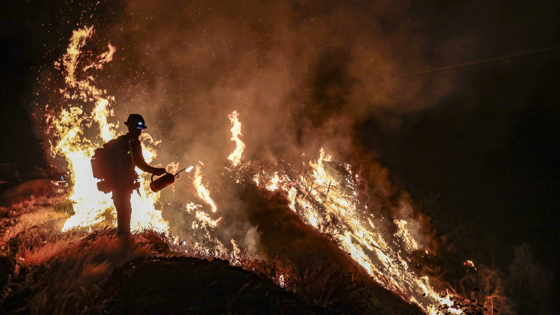 Firefighters battle the Bobcat Fire, north of Mount Wilson, CA, along Angeles Crest Highway on Sept. 22.
