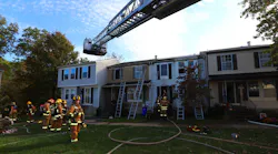 A Howard County, MD, firefighter was injured during a two-alarm townhouse blaze Friday.