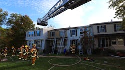 A Howard County, MD, firefighter was injured during a two-alarm townhouse blaze Friday.