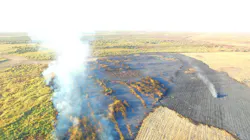 A photograph from an Artesia, NM, Police Department drone shows a major brush fire burning in the old Lake McMillan bed on Oct. 16. Seven Eddy County volunteer fire departments responded to the blaze along with Eddy County Fire Services.