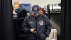 Fogelsville, PA, Volunteer Fire Company live-in firefighter Nick Bosga checks his smartphone outside the sleeping quarters. Fogelsville, PA, Volunteer Fire Company live-in firefighter Nick Bosga checks his smartphone outside the sleeping quarters.
