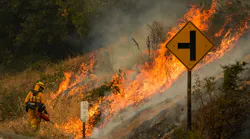 A firefighter uses a drip torch during a backfire operation Sept. 29 during the Glass Fire along Silverado Trail in Calistoga, CA.