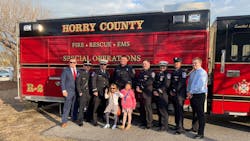 Horry County, SC, volunteer firefighter and Myrtle Beach Police Officer Jacob Hancher (center). Horry County, SC, volunteer firefighter and Myrtle Beach Police Officer Jacob Hancher (center).