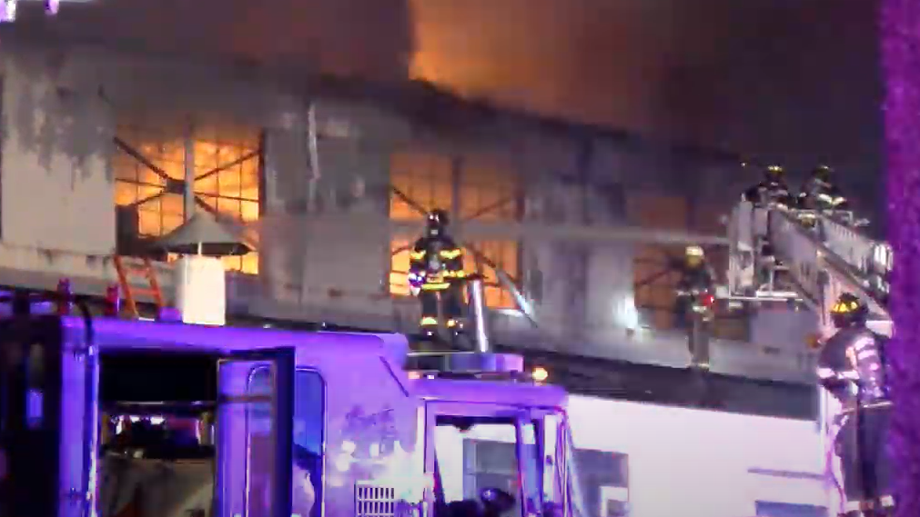 Firefighters from multiple departments battled a four-alarm blaze that erupted at a steel processing plant in Kenilworth late Saturday.