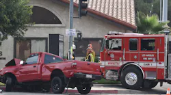Two Los Angeles firefighters were injured in a collision with a pickup truck Monday.