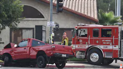 Two Los Angeles firefighters were injured in a collision with a pickup truck Monday.