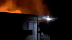Nearly 40 Oakland, CA, firefighters battled a two-alarm blaze that broke out at a two-story apartment building Tuesday.
