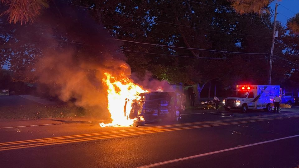 Two Palmer, PA, Municipal Fire Department firefighters came upon a vehicle that had rolled over and caught fire Wednesday and pulled out two occupants who were trapped inside.
