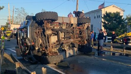 A Rockaway Point, NY, firefighter was injured when the apparatus he was in rolled over while responding to an emergency Saturday in the Breezy Point section of Queens.
