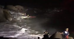 San Francisco firefighters rescue a person from the rocks in the water around the Presidio early Wednesday. San Francisco firefighters rescue a person from the rocks in the water around the Presidio early Wednesday.