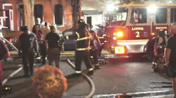 Two Trenton, NJ, firefighters were injured battling a three-alarm blaze early Saturday that tore through several buildings.