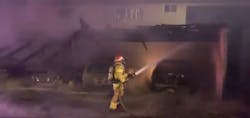 Orange County, CA, firefighters stopped a carport blaze from spreading to a large apartment building early Thursday.