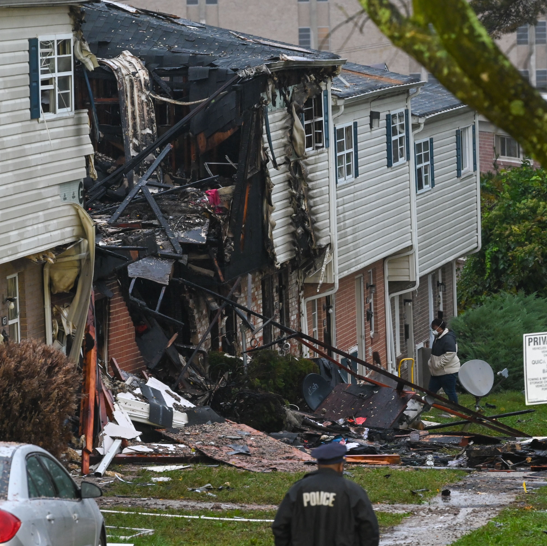 A three-alarm residential fire caused by a 'possible explosion' in northwest Baltimore injured three adults and two children late Sunday.