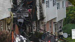 A three-alarm residential fire caused by a 'possible explosion' in northwest Baltimore injured three adults and two children late Sunday.