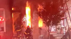 Two Baltimore City firefighters were injured during a blaze that broke out at a two-story rowhouse late Friday.