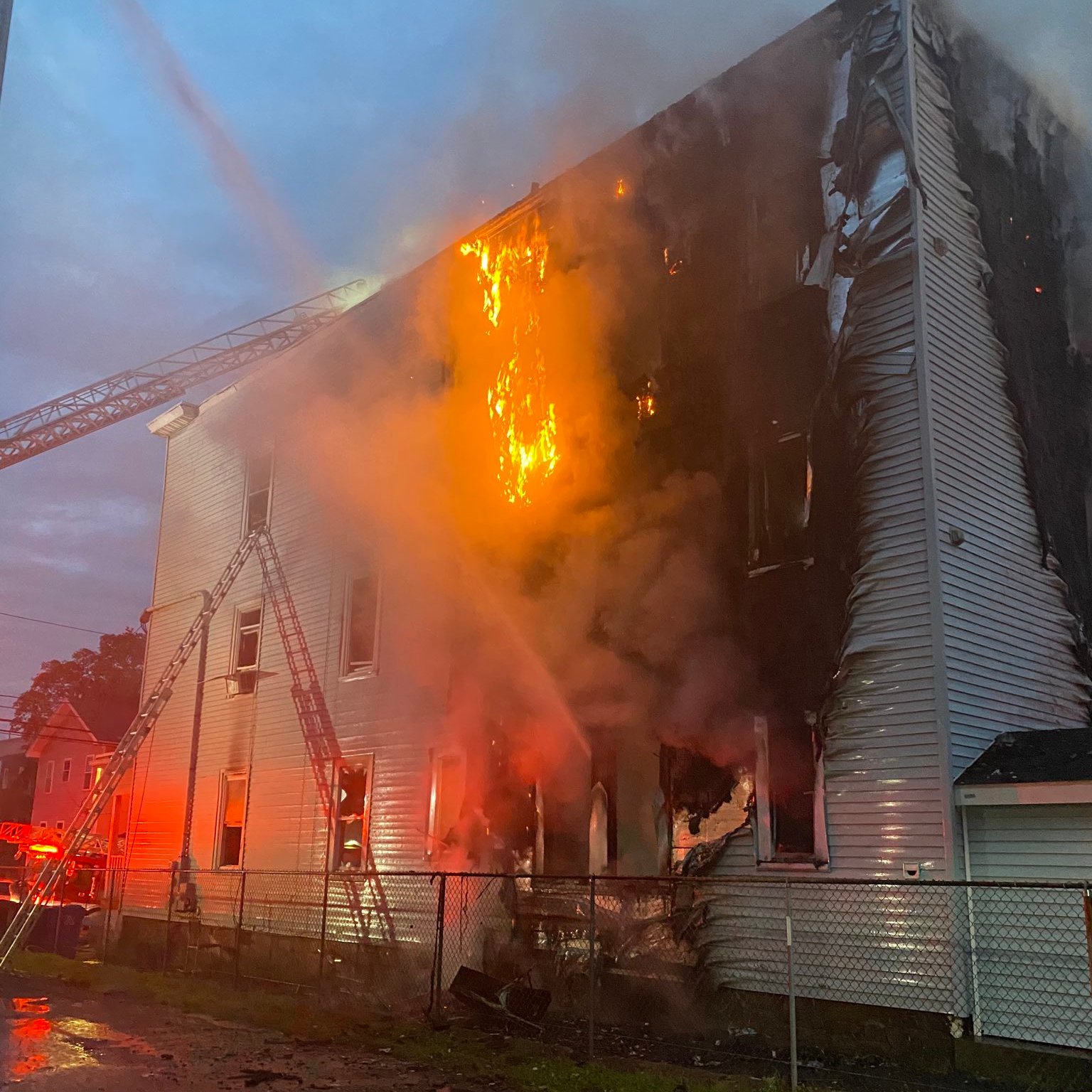 Boston firefighters battled a three-alarm blaze that broke out at a three-floor home in Dorchester on Friday.