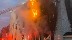 Boston firefighters battled a three-alarm blaze that broke out at a three-floor home in Dorchester on Friday.